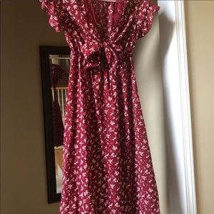 Sun dress. Falls below knee for a 5’2” height